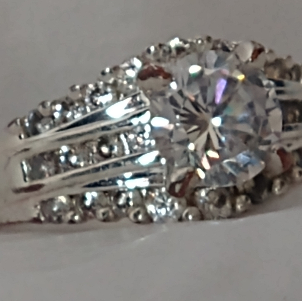 Silvertone princess-cut cubic zirconia engagement ring.